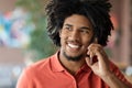 Phone Call. Closeup Of Smiling Millennial Black Man Talking On Cellphone Indoors Royalty Free Stock Photo