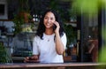 Phone call, coffee and woman in cafe talking, chatting or speaking to contact online. Tea, technology and happy female Royalty Free Stock Photo