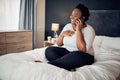 Phone call, happy and black woman on bed in home, talking and communication in the morning. Smartphone, conversation and Royalty Free Stock Photo