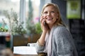 Phone call, happy and woman with books in coffee shop for connection, social networking and talking. Restaurant, cafe Royalty Free Stock Photo
