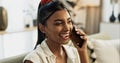 Phone call, laughing and young woman on a sofa for relaxing in the living room of apartment. Happy, smile and Indian Royalty Free Stock Photo