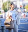 Phone call, shopping bag and smile of Asian woman with mobile mockup screen on city street. Retail customer, chat and Royalty Free Stock Photo
