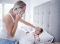 Phone call, sick and child in bed with mother feeling for fever with hand on forehead with worry, care and love. .Family Royalty Free Stock Photo