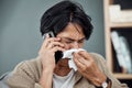 Phone call, sick and woman blowing her nose for the flu, cold or sinus allergies at her home. Illness, telehealth and Royalty Free Stock Photo