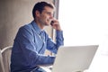 Phone call, smile and businessman with laptop in office for planning, networking or web communication. Smartphone Royalty Free Stock Photo