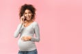 Phone call. Smiling afro pregnant woman consulting with doctor