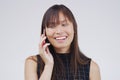 Phone call, talking and Asian woman in studio smile for conversation, speaking and chatting. Communication mockup, white Royalty Free Stock Photo