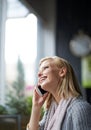 Phone call, talking and woman with smile in coffee shop for connection, social networking and chat. Restaurant Royalty Free Stock Photo