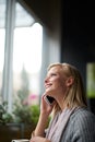 Phone call, thinking and woman in coffee shop happy for connection, social networking and talking. Restaurant, cafe and Royalty Free Stock Photo