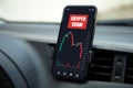 phone with chart scam crypto coins screen inside the car Royalty Free Stock Photo
