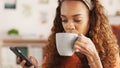 Phone, coffee and communication with a black woman on social media while drinking from a mug in her home. Relax, mobile