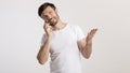 Man Talking On Cellphone Gesturing And Smiling On White Background Royalty Free Stock Photo