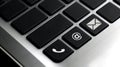 Phone, email and mail icon on laptop keyboard button. Royalty Free Stock Photo