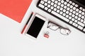 Phone, glasses, pen, notebook, keyboard on office desk Royalty Free Stock Photo