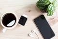 Phone and hand watch on wood desk top Royalty Free Stock Photo