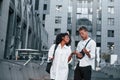 Walking together. Man with afrian american woman together in the city outdoors Royalty Free Stock Photo