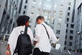 Walking together. Man with afrian american woman together in the city outdoors Royalty Free Stock Photo