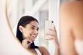Phone, happy and selfie of woman in bathroom with smile for natural social media beauty in mirror. Reflection, happiness