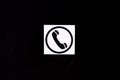 Phone icon, telephone symbol on a black background. Communication concept