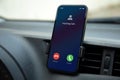 phone with incoming call on screen inside the car Royalty Free Stock Photo