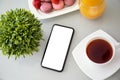 Phone with isolated screen on a girl desk