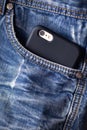 Phone in jeans pocket close up