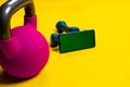 Phone kettlebell space yellow dumbbells lue isolated iron fit, concept healthy lifestyle lifting black from bell from Royalty Free Stock Photo