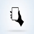 Phone in a man`s hand sign icon or logo. Mobile phone in hand concept. holding smart mobile phone vector illustration
