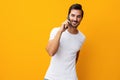 Studio man smiling communication space happy phone mobile yellow cyberspace portrait copy smartphone phone Royalty Free Stock Photo