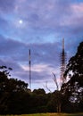 Phone masts in nature under a full moon at twiligh Royalty Free Stock Photo