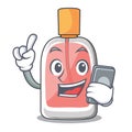 With phone perfume in the a cartoon bottle Royalty Free Stock Photo