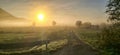 Beautiful scenic sunrise landscape with some fog in background