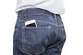 Phone in pocket of blue jeans denim