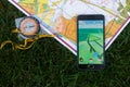 Phone with Pokemon Go application on screen, maps and compas. Royalty Free Stock Photo