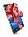 Phone and red ribbon gift Royalty Free Stock Photo