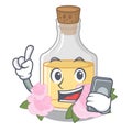 With phone rose oil stored character the glass Royalty Free Stock Photo