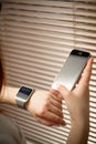 Phone and smart watch on a female hand