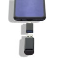 Phone or smartphone with USB OTG data transfer connected to a USB flash drive, read and write any information from Royalty Free Stock Photo