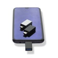Phone or smartphone with USB OTG data transfer connected to a USB flash drive, read and write any information from Royalty Free Stock Photo
