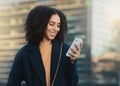 Phone, social media and communication with a business black woman typing a text message in the city. Mobile, networking Royalty Free Stock Photo