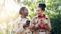 Phone, social media and woman friends outdoor walking in the park together during summer with flare. Smile, fashion