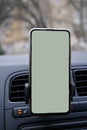 Phone on the stand in the car, Navigator, mock up, copy space Royalty Free Stock Photo