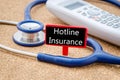 Phone and stethoscope with Hotline insurance.