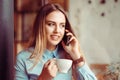 Phone talk. Cafe city lifestyle smiling woman on phone drinking coffee talking texting text message on smartphone app sitting Royalty Free Stock Photo