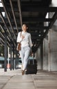 Phone, thinking and suitcase with a business woman walking in an airport parking lot outdoor in the city. Mobile Royalty Free Stock Photo