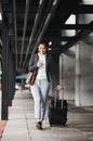 Phone, travel and suitcase with a business woman walking in an airport parking lot outdoor in the city. Mobile, luggage Royalty Free Stock Photo