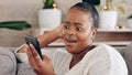 Phone, video call and black woman on a sofa happy, smile and relax in her home. Internet, conversation and female Royalty Free Stock Photo