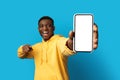 Phone with white empty screen in african man hand Royalty Free Stock Photo