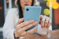 Phone, woman and hand with bokeh for communication, social network and internet chat with technology. Smartphone, person