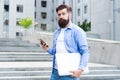 Phone you always desired. Bearded man use phone outdoors. Mobile phone messaging. SMS message. Cell phone. Smartphone Royalty Free Stock Photo